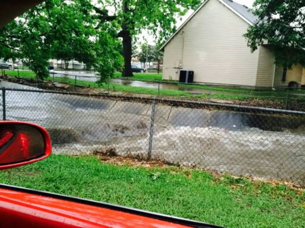 Storm photo, Coulee along Parkside between University and Azalea extremly full 2
